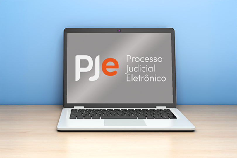 desenho de um notebook. Na tela, a logomarca do PJe