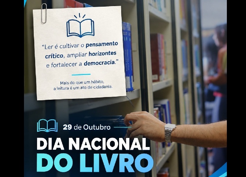 Imagem comemorativa do "Dia Nacional do Livro" (29 de Outubro). Em segundo plano, vê-se uma mão a alcançar um livro numa estante de biblioteca. Do lado esquerdo, sobressaem as inscrições: "29 de Outubro - DIA NACIONAL DO LIVRO" e uma nota presa por um clipe com a frase: “Ler é cultivar o pensamento crítico, ampliar horizontes e fortalecer a democracia. Mais do que um hábito, a leitura é um ato de cidadania”.