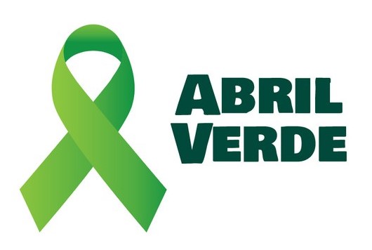 Logo da campanha Abril Verde, formado por um laço de fita verde e o texto "abril verde" ao lado.